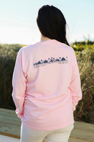 Blossom pink Long sleeve Unisex Seaside Tee back showing SEASIDE townscape new town old ways in navy