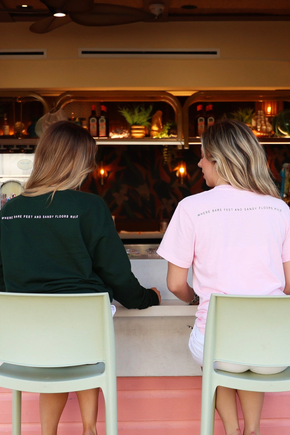 Green Lightweight Unisex Seaside Sweatshirt and pink tee back where bare feet and sandy floors rule