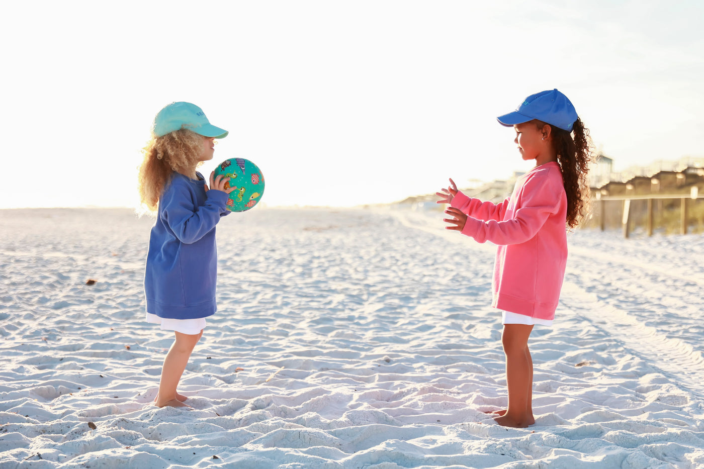 Seaside Kids playing on beach in Seaside Sweatshirts and Seaside Hats