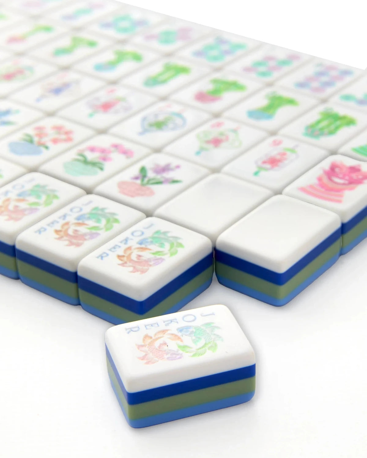 Set of colorful mahjong tiles with floral designs on a white background