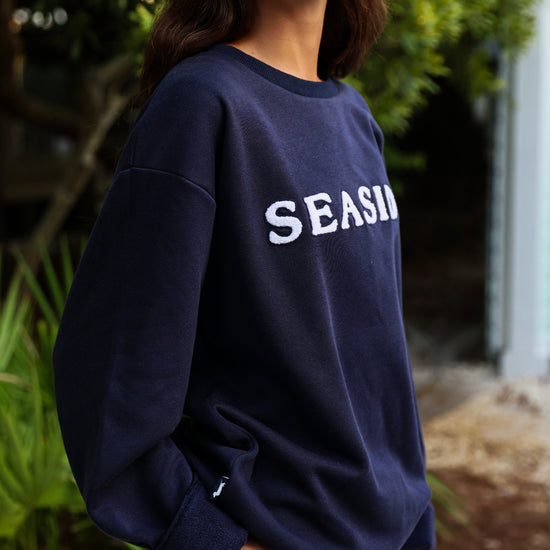 Navy Chenille Seaside Sweatshirt Detail shot showcasing bud tag and logo