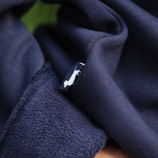 Navy Chenille Seaside Sweatshirt showcasing bud the dachshund 