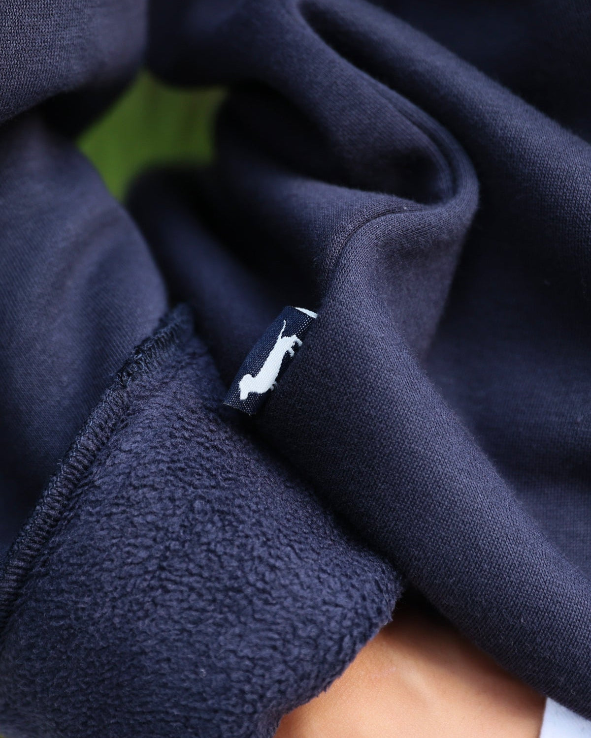 Navy Chenille Seaside Sweatshirt showcasing bud the dachshund 