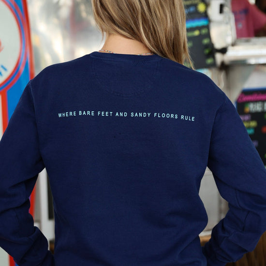 Navy Blue Colors of Seaside Rainbow Sweatshirt Back with Where Bare Feet and Sandy Floors Rule 