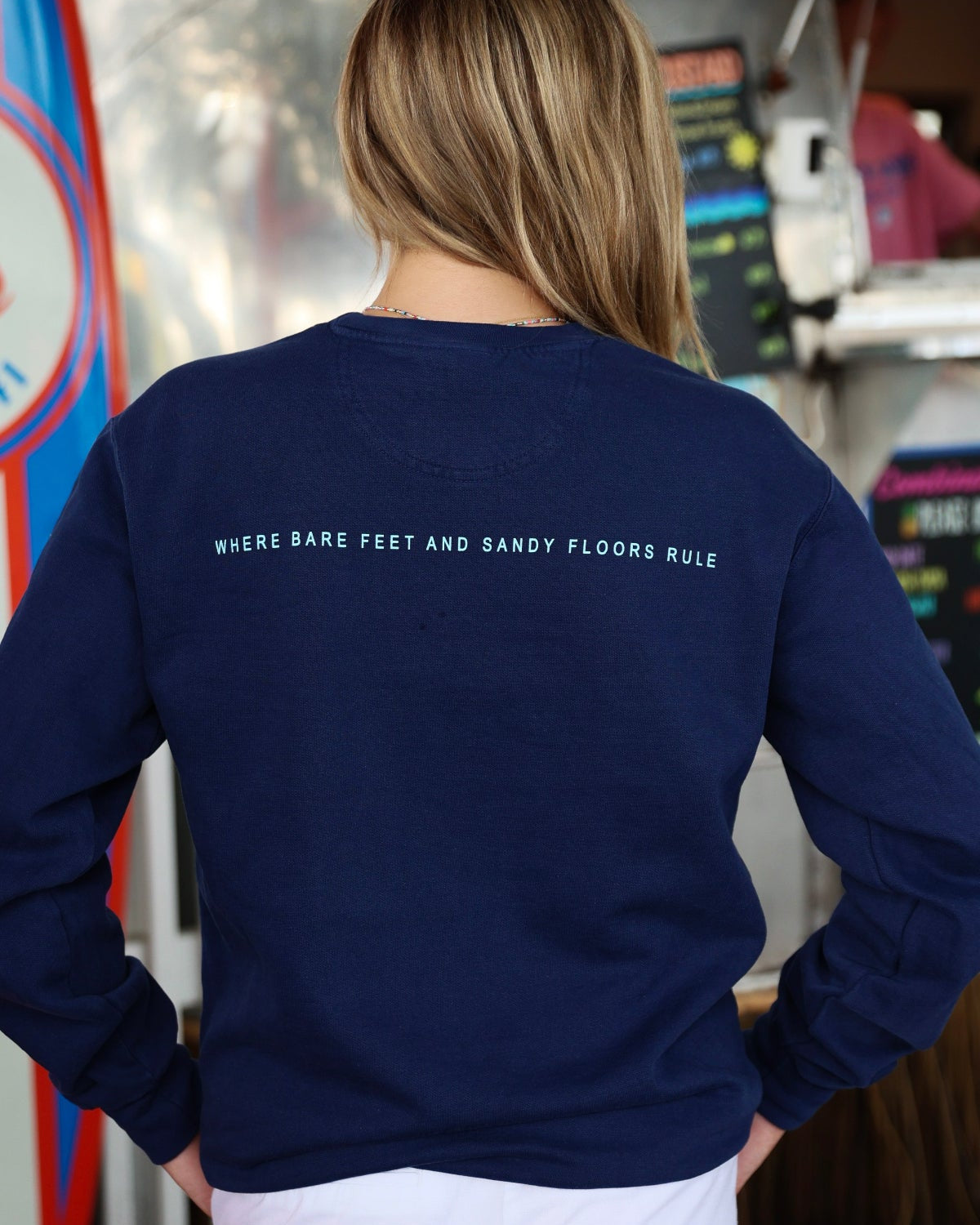 Navy Blue Colors of Seaside Rainbow Sweatshirt Back with Where Bare Feet and Sandy Floors Rule 
