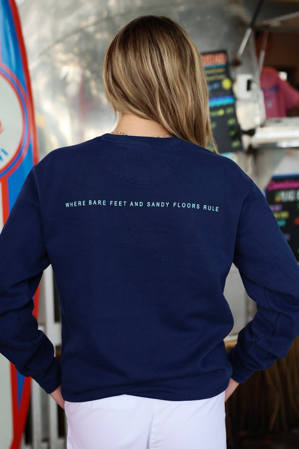 Navy Blue Colors of Seaside Rainbow Sweatshirt Back with Where Bare Feet and Sandy Floors Rule 
