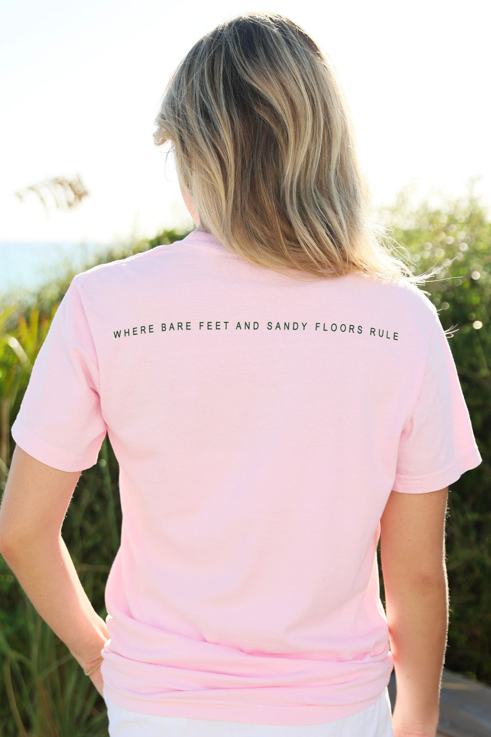 Pink Shortsleeve Unisex Seaside Tee back where bare feet and sandy floors rule