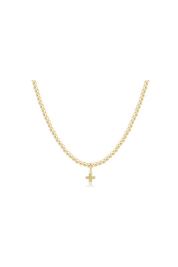 A delicate gold chain necklace with a small cross pendant, displayed against a solid white background.