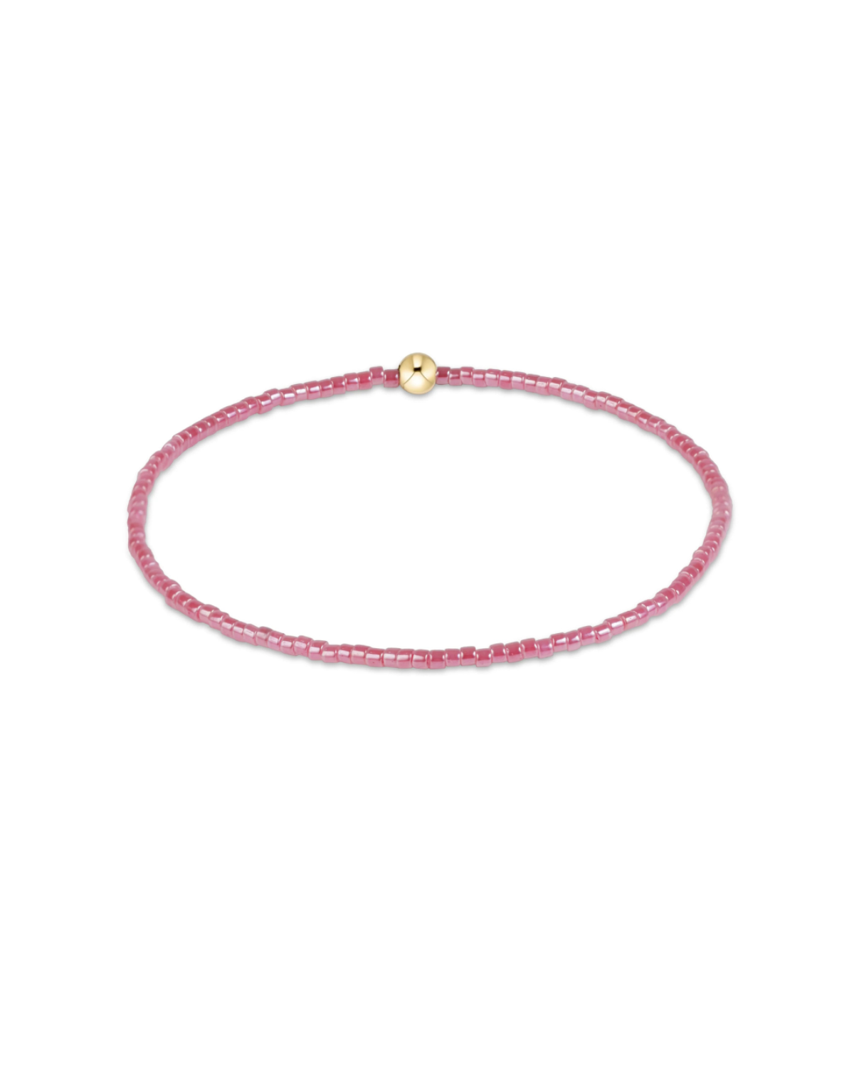 A delicate pink beaded bracelet with a small gold bead accent at the clasp, displayed on a clean white background.