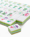 Decorative mahjong tiles with colorful designs on a white background